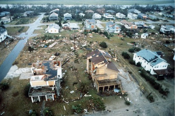 An overview of damaged homes near Charleston Air Force Base in the aftermath of Hurricane Hugo. Photographed by MSGT Patrick Nugent.